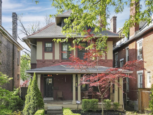 1041 Franklin Ave, Columbus, OH 43205 - view of front of house with covered porch, brick siding, stucco siding, and cooling unit