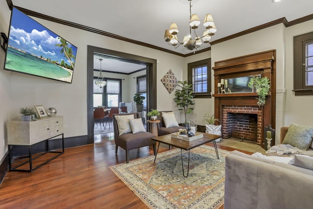 1041 Franklin Ave, Columbus, OH 43205 - living area featuring a chandelier, ornamental molding, wood finished floors, a fireplace, and baseboards