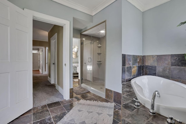 1041 Franklin Ave, Columbus, OH 43205 - full bathroom with a garden tub, a stall shower, ornamental molding, and baseboards