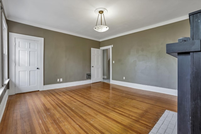 1041 Franklin Ave, Columbus, OH 43205 - spare room featuring hardwood / wood-style floors, crown molding, and baseboards