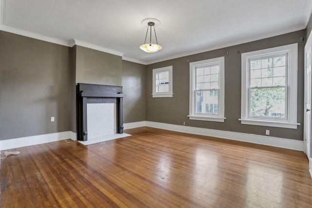 1041 Franklin Ave, Columbus, OH 43205 - unfurnished living room with a fireplace with flush hearth, ornamental molding, wood finished floors, and baseboards