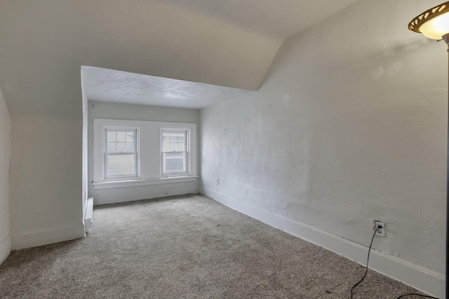 1041 Franklin Ave, Columbus, OH 43205 - spare room with carpet flooring, baseboards, and lofted ceiling