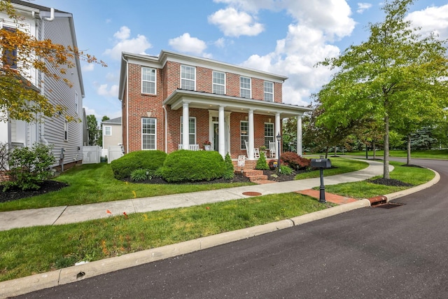 5119 Butterworth Green Dr, New Albany, OH 43054 - view of front of house with brick siding and a porch