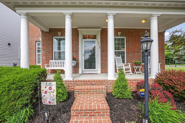 5119 Butterworth Green Dr, New Albany, OH 43054 - view of exterior entry with covered porch and brick siding