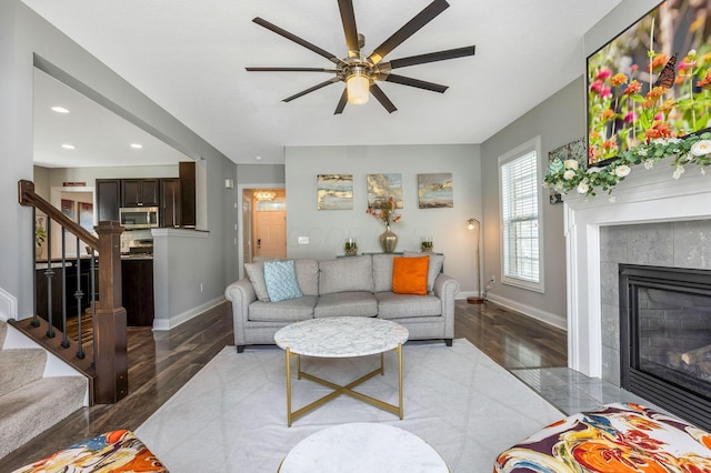 5119 Butterworth Green Dr, New Albany, OH 43054 - living room featuring a tile fireplace, stairway, baseboards, ceiling fan, and recessed lighting