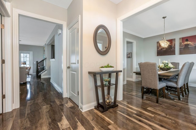 5119 Butterworth Green Dr, New Albany, OH 43054 - dining space with dark wood-style flooring, stairs, baseboards, and a chandelier