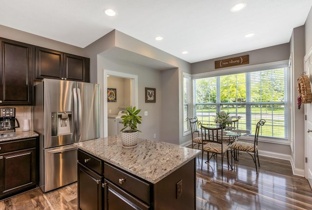 5119 Butterworth Green Dr, New Albany, OH 43054 - kitchen featuring stainless steel fridge with ice dispenser, baseboards, recessed lighting, light stone countertops, and dark brown cabinetry