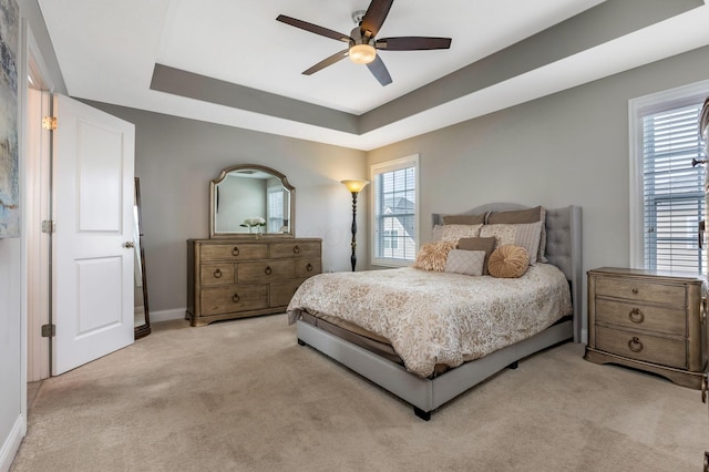 5119 Butterworth Green Dr, New Albany, OH 43054 - bedroom with light colored carpet, a tray ceiling, baseboards, and ceiling fan