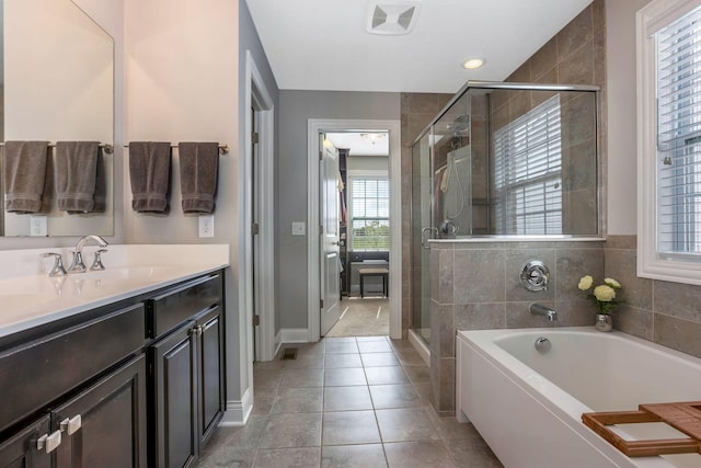 5119 Butterworth Green Dr, New Albany, OH 43054 - bathroom featuring a stall shower, vanity, a garden tub, and tile patterned flooring