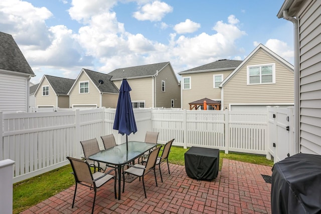 5119 Butterworth Green Dr, New Albany, OH 43054 - view of patio / terrace with a fenced backyard, outdoor dining area, a residential view, and grilling area