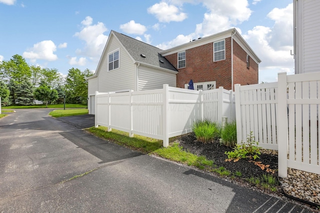 5119 Butterworth Green Dr, New Albany, OH 43054 - view of home's exterior featuring brick siding and fence