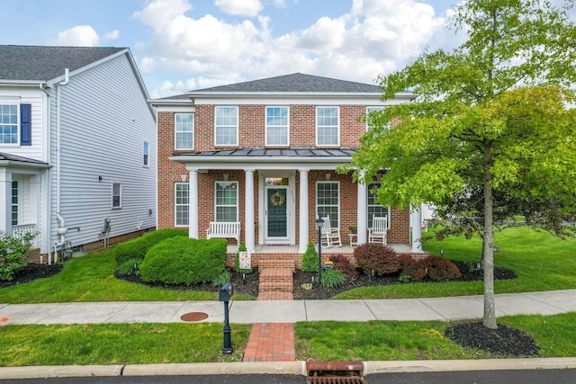 5119 Butterworth Green Dr, New Albany, OH 43054 - view of front of home featuring brick siding, a standing seam roof, and a front lawn