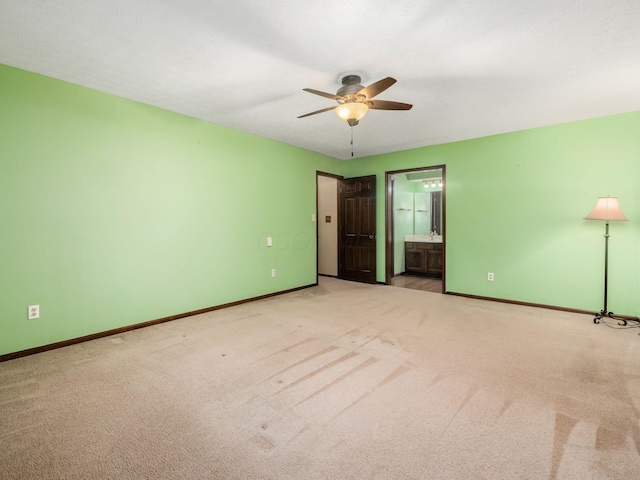 6079 Catawba Dr, Grove City, OH 43123 - unfurnished bedroom with baseboards, carpet, connected bathroom, and a ceiling fan
