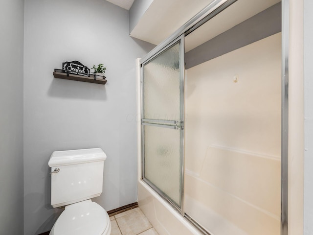 6079 Catawba Dr, Grove City, OH 43123 - bathroom featuring tile patterned flooring, toilet, and enclosed tub / shower combo