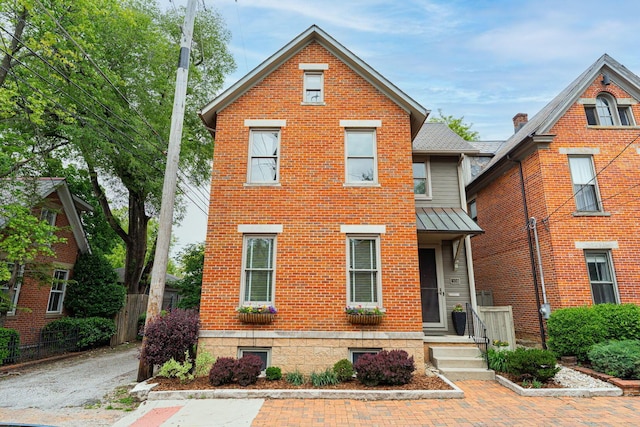 308 Jackson St, Columbus, OH 43206 - traditional-style house with a standing seam roof, metal roof, and brick siding
