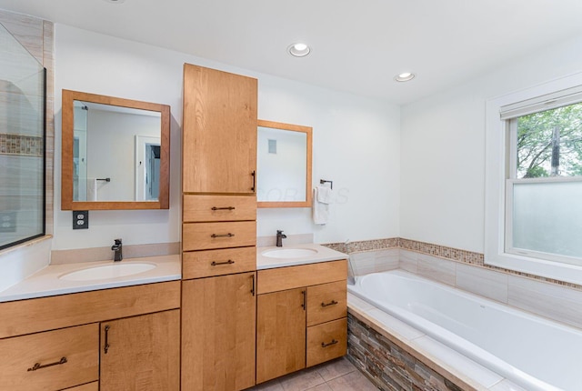 308 Jackson St, Columbus, OH 43206 - bathroom featuring a bath, double vanity, tile patterned floors, recessed lighting, and a tile shower