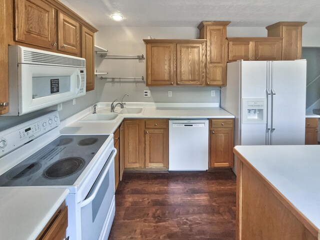 3495 Halpern St, Columbus, OH 43230 - kitchen featuring white appliances, dark wood finished floors, brown cabinetry, open shelves, and light countertops