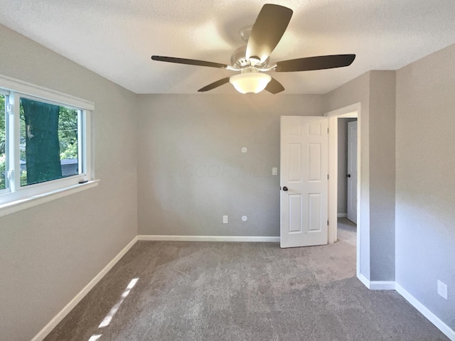 3495 Halpern St, Columbus, OH 43230 - empty room with ceiling fan, carpet floors, and a textured ceiling