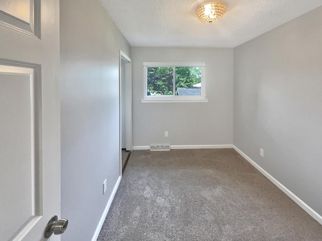 3495 Halpern St, Columbus, OH 43230 - empty room featuring dark carpet and a textured ceiling