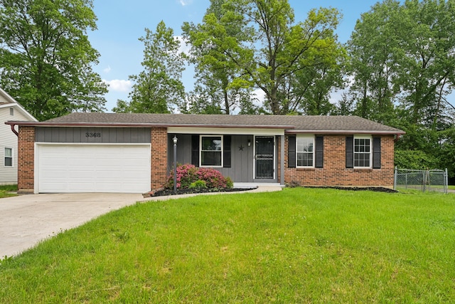 3368 Pine Valley Rd, Columbus, OH 43219 - ranch-style home with board and batten siding, an attached garage, driveway, and brick siding