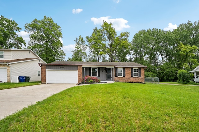 3368 Pine Valley Rd, Columbus, OH 43219 - single story home featuring brick siding, an attached garage, concrete driveway, and board and batten siding