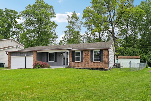 3368 Pine Valley Rd, Columbus, OH 43219 - ranch-style home featuring a garage and brick siding