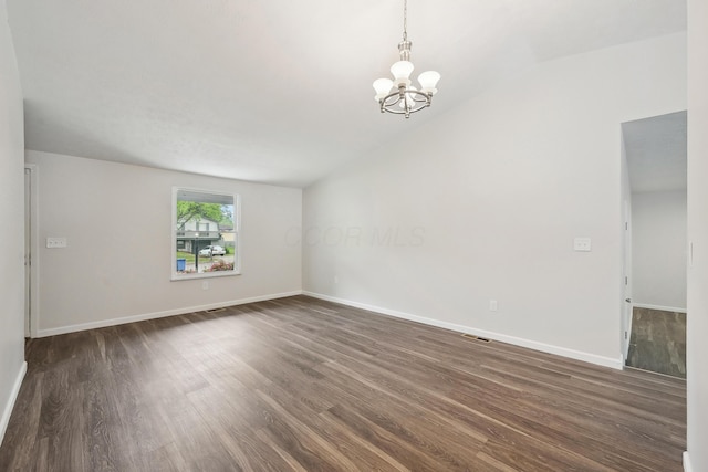 3368 Pine Valley Rd, Columbus, OH 43219 - spare room with a chandelier, dark wood-style flooring, vaulted ceiling, and baseboards