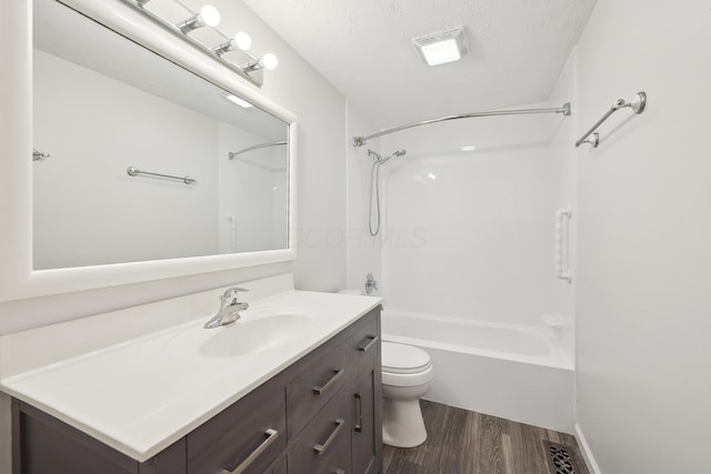 3368 Pine Valley Rd, Columbus, OH 43219 - bathroom with wood finished floors, vanity, toilet, shower / tub combination, and a textured ceiling