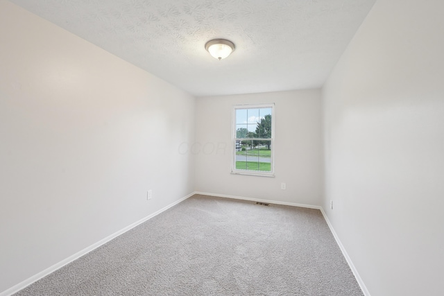 3368 Pine Valley Rd, Columbus, OH 43219 - carpeted spare room featuring baseboards and a textured ceiling