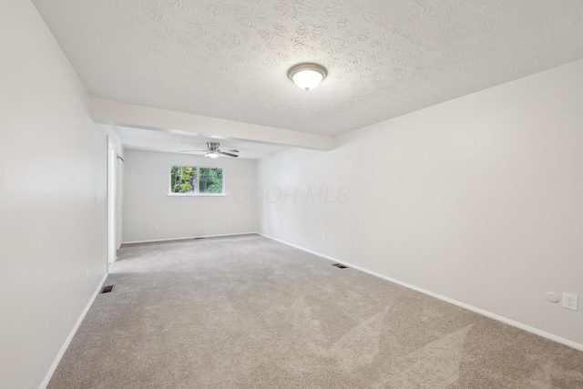 3368 Pine Valley Rd, Columbus, OH 43219 - carpeted empty room featuring baseboards, a textured ceiling, and ceiling fan