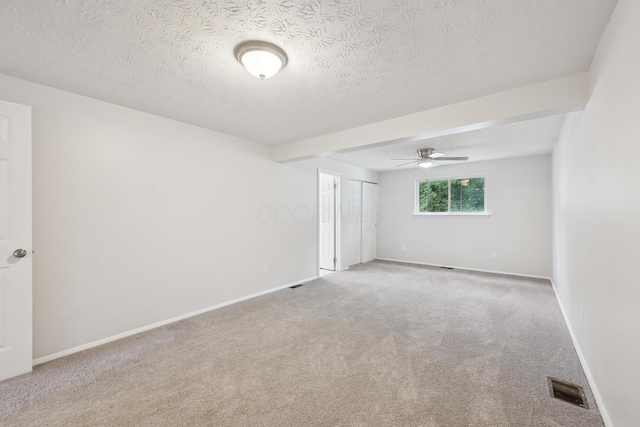 3368 Pine Valley Rd, Columbus, OH 43219 - unfurnished room with carpet floors, a textured ceiling, a ceiling fan, and baseboards