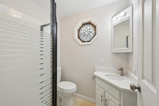 3368 Pine Valley Rd, Columbus, OH 43219 - bathroom featuring toilet, vanity, and baseboards