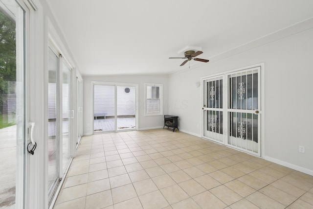 3368 Pine Valley Rd, Columbus, OH 43219 - unfurnished sunroom featuring a wood stove and lofted ceiling