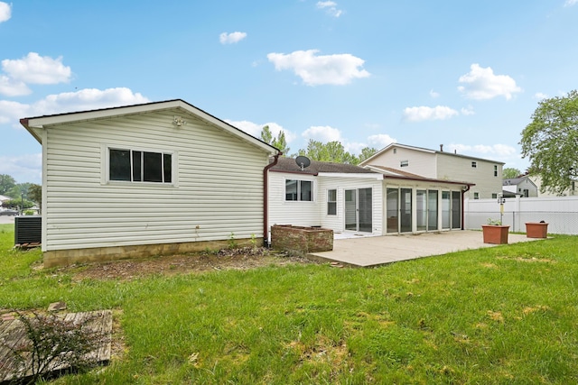 3368 Pine Valley Rd, Columbus, OH 43219 - back of property featuring a patio, a sunroom, and central AC unit