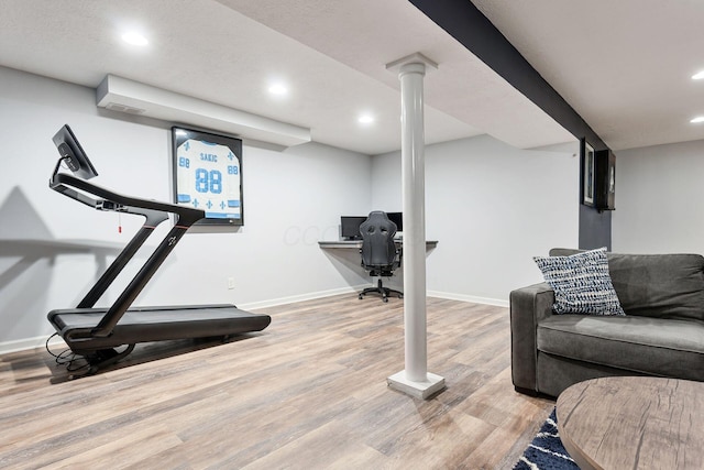workout area with baseboards, recessed lighting, and wood finished floors