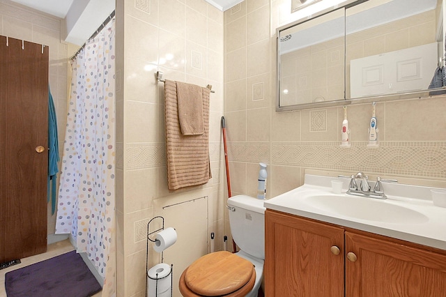 2894 Langfield Dr, Columbus, OH 43209 - full bathroom with tile walls, toilet, vanity, and a shower with shower curtain