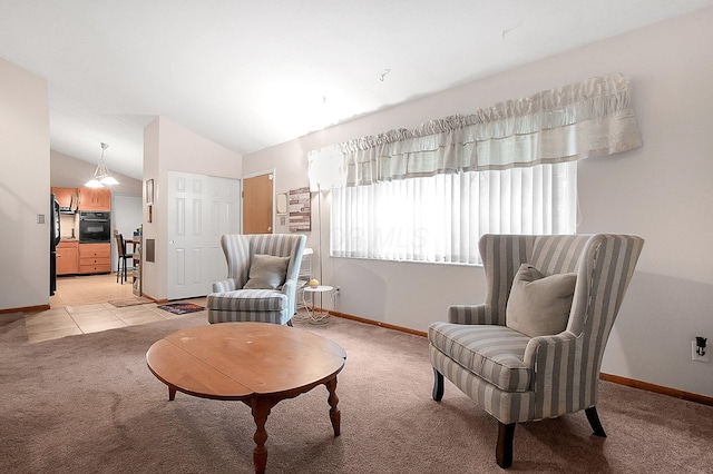 2894 Langfield Dr, Columbus, OH 43209 - sitting room featuring light carpet, baseboards, and vaulted ceiling