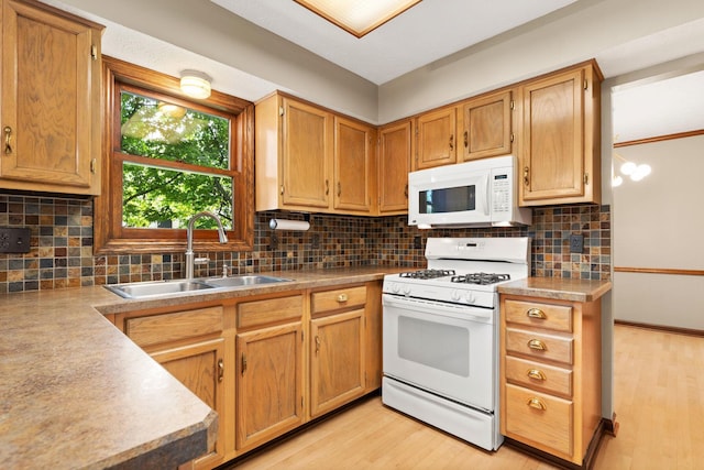 750 Pepper Ct, Westerville, OH 43082 - kitchen featuring white appliances, light wood-style floors, decorative backsplash, and light countertops
