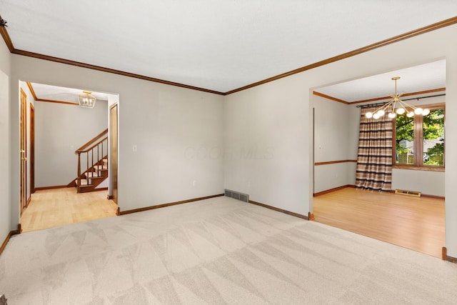 750 Pepper Ct, Westerville, OH 43082 - spare room featuring carpet, a chandelier, ornamental molding, stairway, and wood finished floors