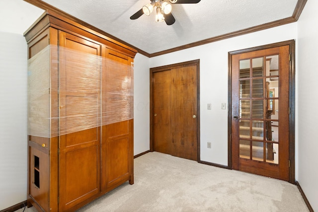 750 Pepper Ct, Westerville, OH 43082 - unfurnished bedroom featuring light carpet, crown molding, a closet, a ceiling fan, and a textured ceiling