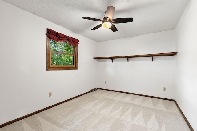 750 Pepper Ct, Westerville, OH 43082 - spare room with light carpet, a ceiling fan, and a textured ceiling