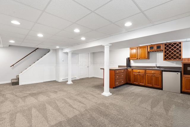 750 Pepper Ct, Westerville, OH 43082 - kitchen with carpet, recessed lighting, brown cabinetry, dark countertops, and dishwasher