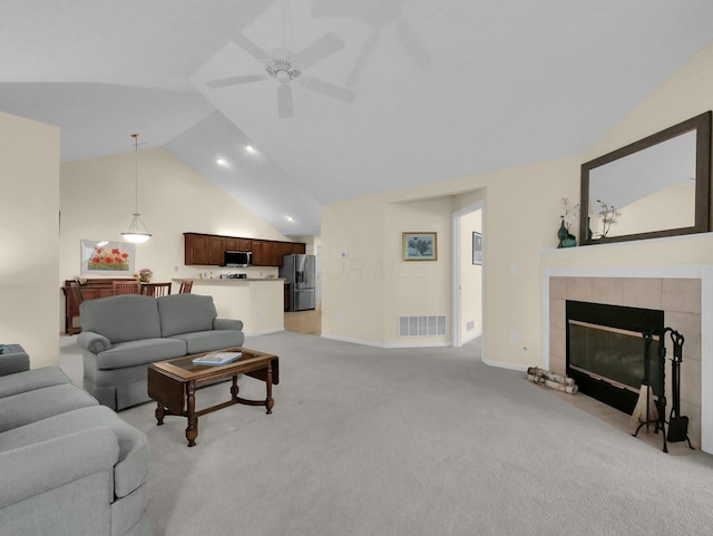 676 Albion Pl, Westerville, OH 43082 - living area with light carpet, ceiling fan, a fireplace, and high vaulted ceiling