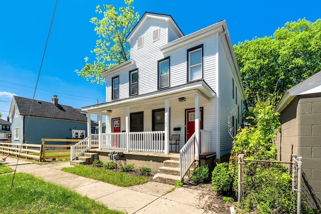 1165 Wager St Unit 1165-1167, Columbus, OH 43206 - view of front facade with a porch and fence