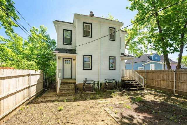 1165 Wager St Unit 1165-1167, Columbus, OH 43206 - rear view of property with a fenced backyard and a chimney