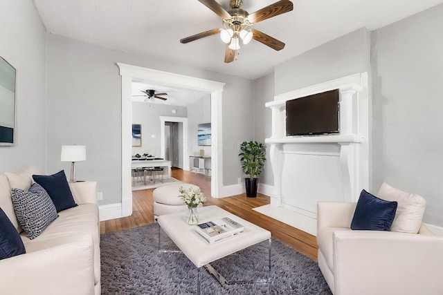 1165 Wager St Unit 1165-1167, Columbus, OH 43206 - living room with wood finished floors, a ceiling fan, and baseboards