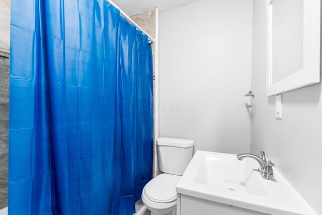 1165 Wager St Unit 1165-1167, Columbus, OH 43206 - bathroom with toilet, vanity, and a shower with shower curtain