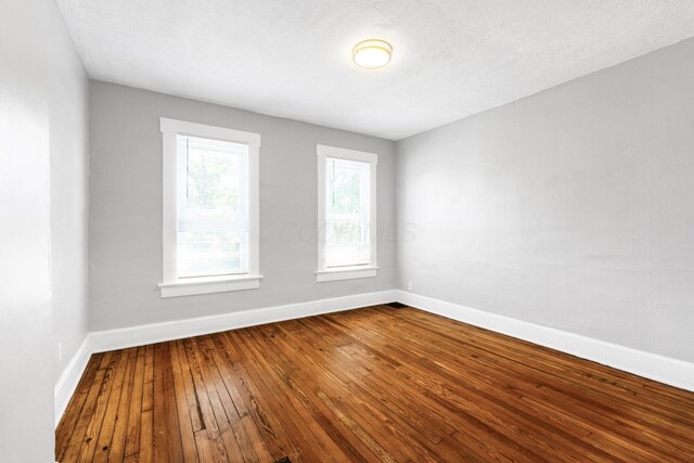 1165 Wager St Unit 1165-1167, Columbus, OH 43206 - empty room featuring baseboards and dark wood-type flooring