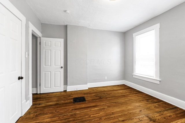 1165 Wager St Unit 1165-1167, Columbus, OH 43206 - unfurnished bedroom with dark wood-style flooring and baseboards