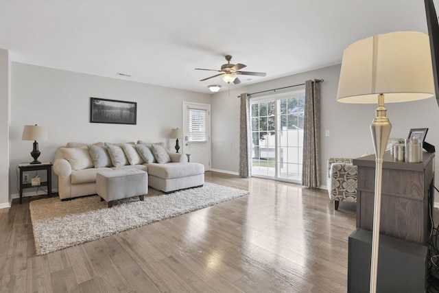 4712 Shalers Dr Unit 54A, Columbus, OH 43228 - living area with a ceiling fan, baseboards, and wood finished floors